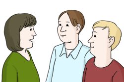Zwei Menschen hören einer anderen Person zu
